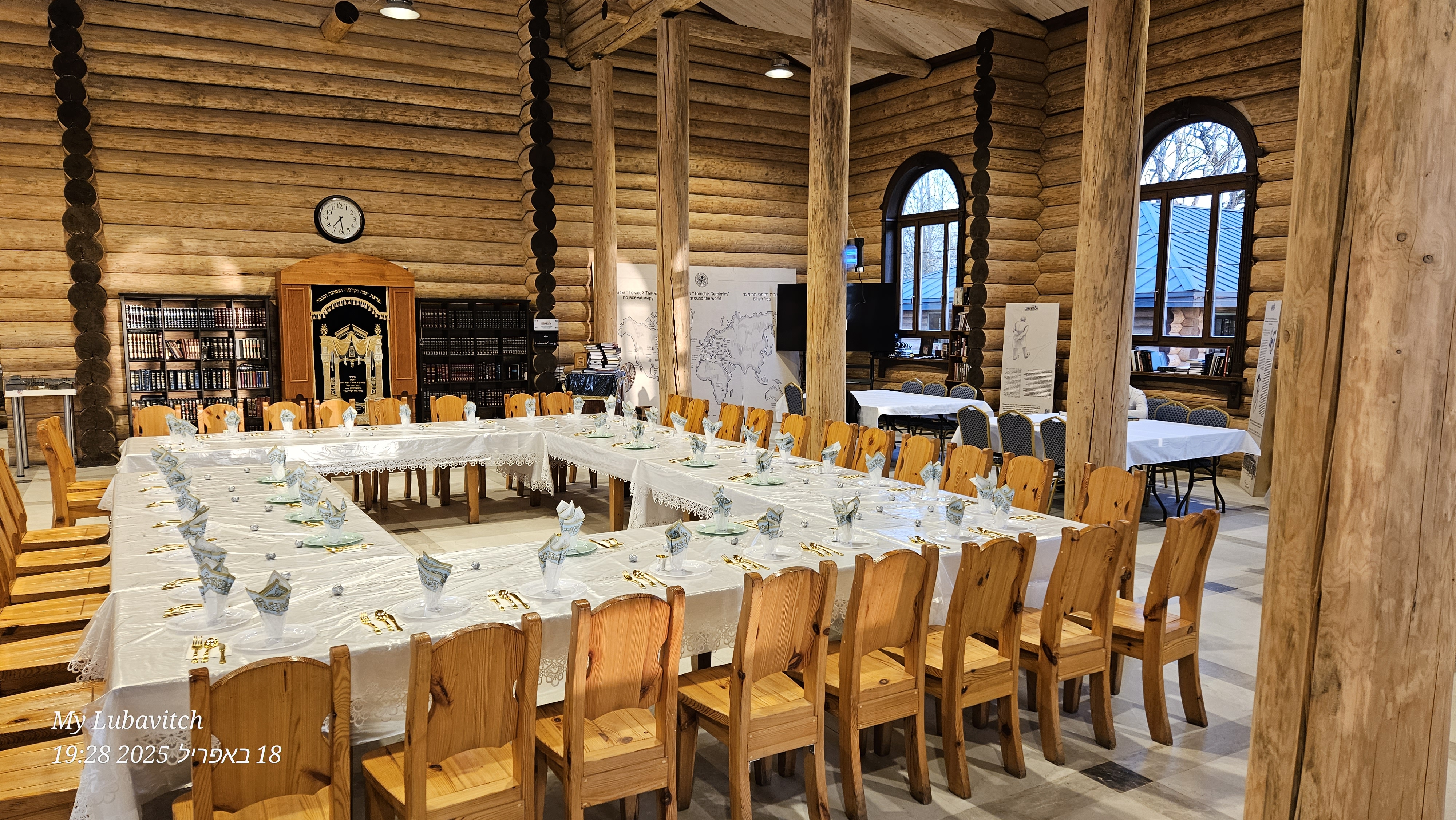 Interior corner view — log walls and arched windows
